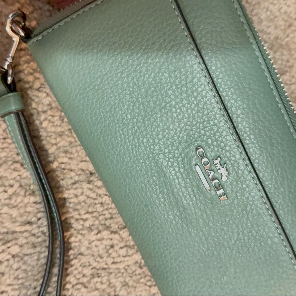 Coach Mint Green Leather Wristlet
Matching Bag in my closet Bundle for Deals! - Picture 5 of 8